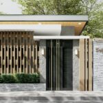 A stylish entrance of a luxury residence characterized by modern vertical slats and lush greenery.